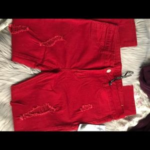 Red distressed jeans